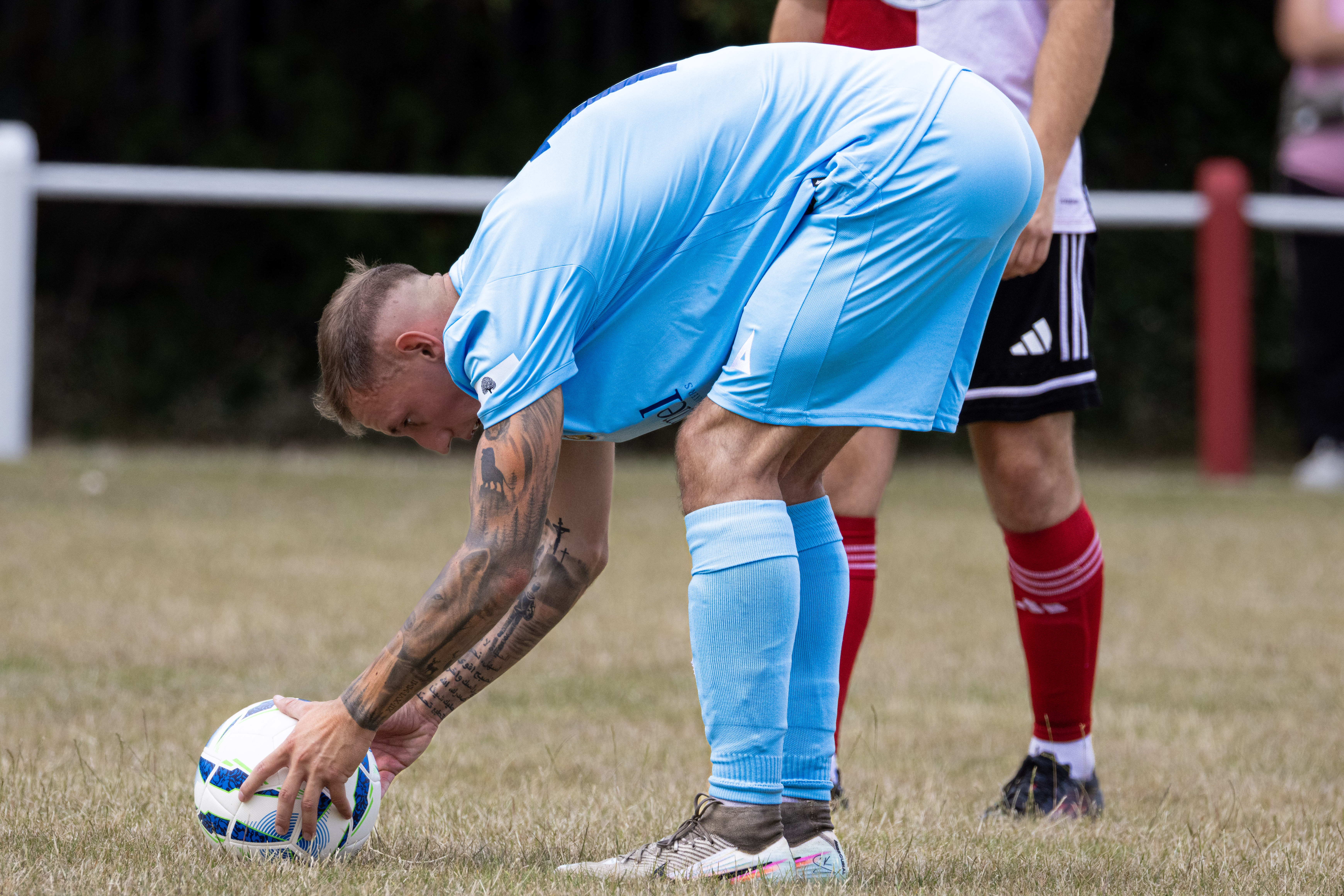 Football player placing the ball for a set piece